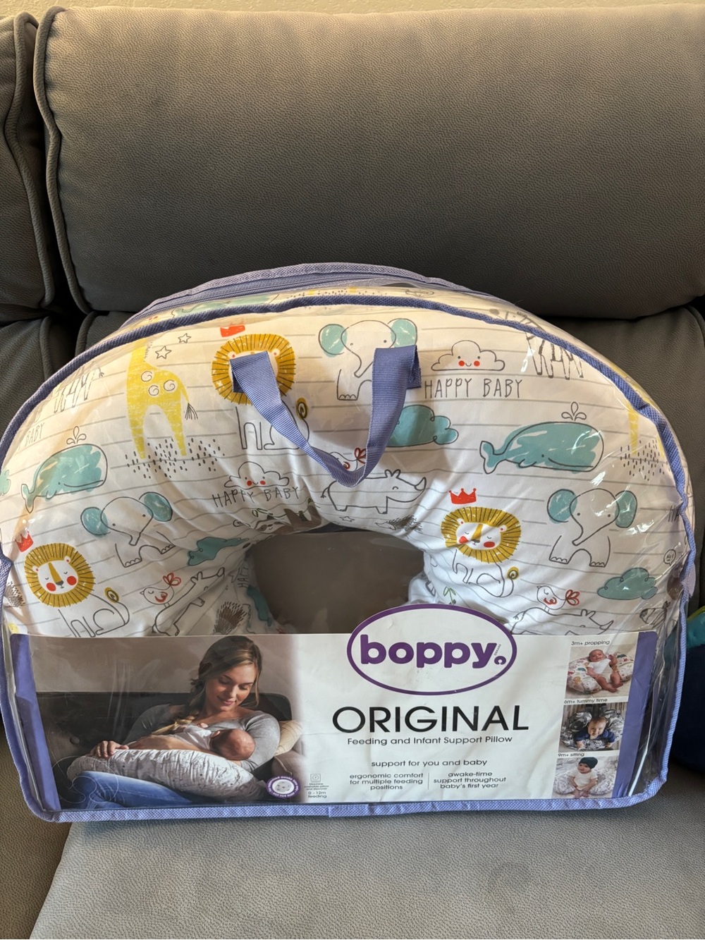 Boppy Original Nursing Pillow - White with Yellow, Blue and Green Animal Print
